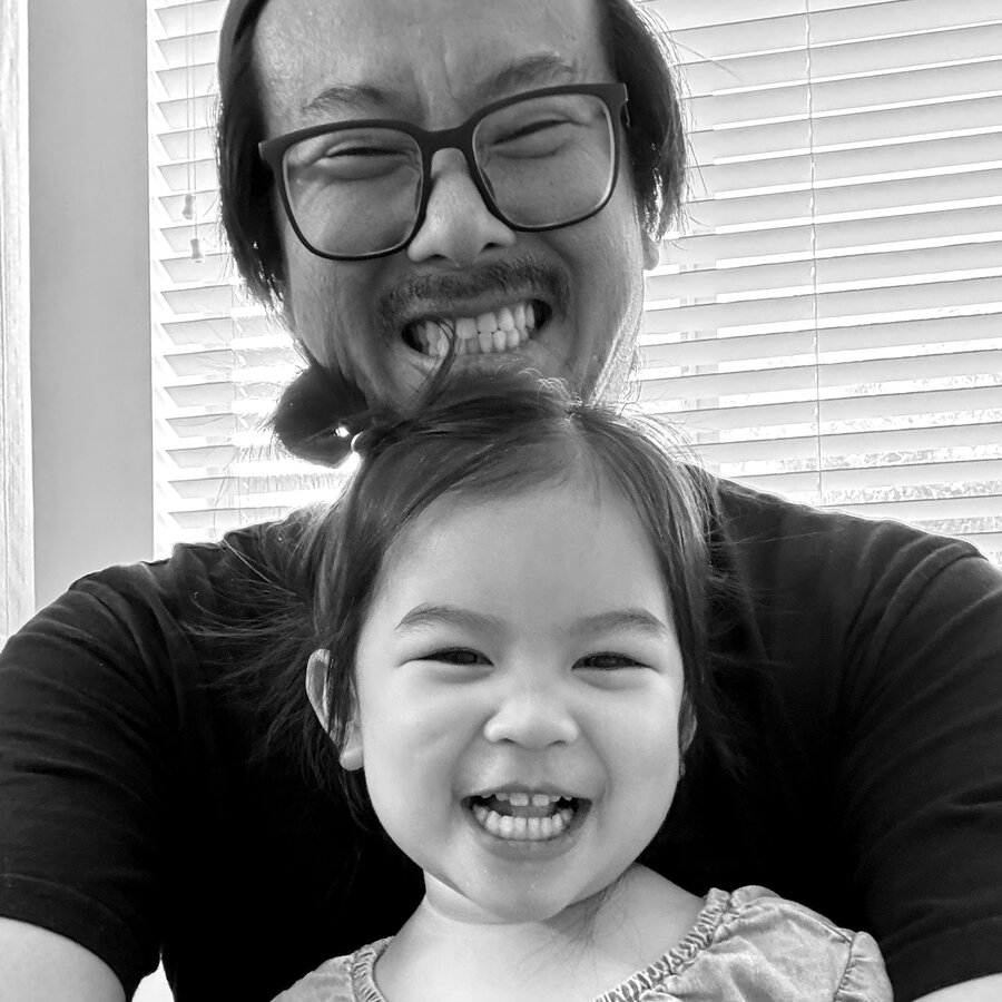 San making a silly face with his daughter